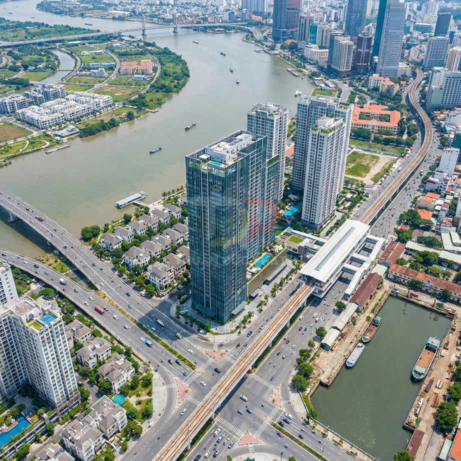 Tòa nhà chung cư cao tầng bên tuyến metro và ngã tư đường lớn cạnh sông tại khu đô thị hiện đại